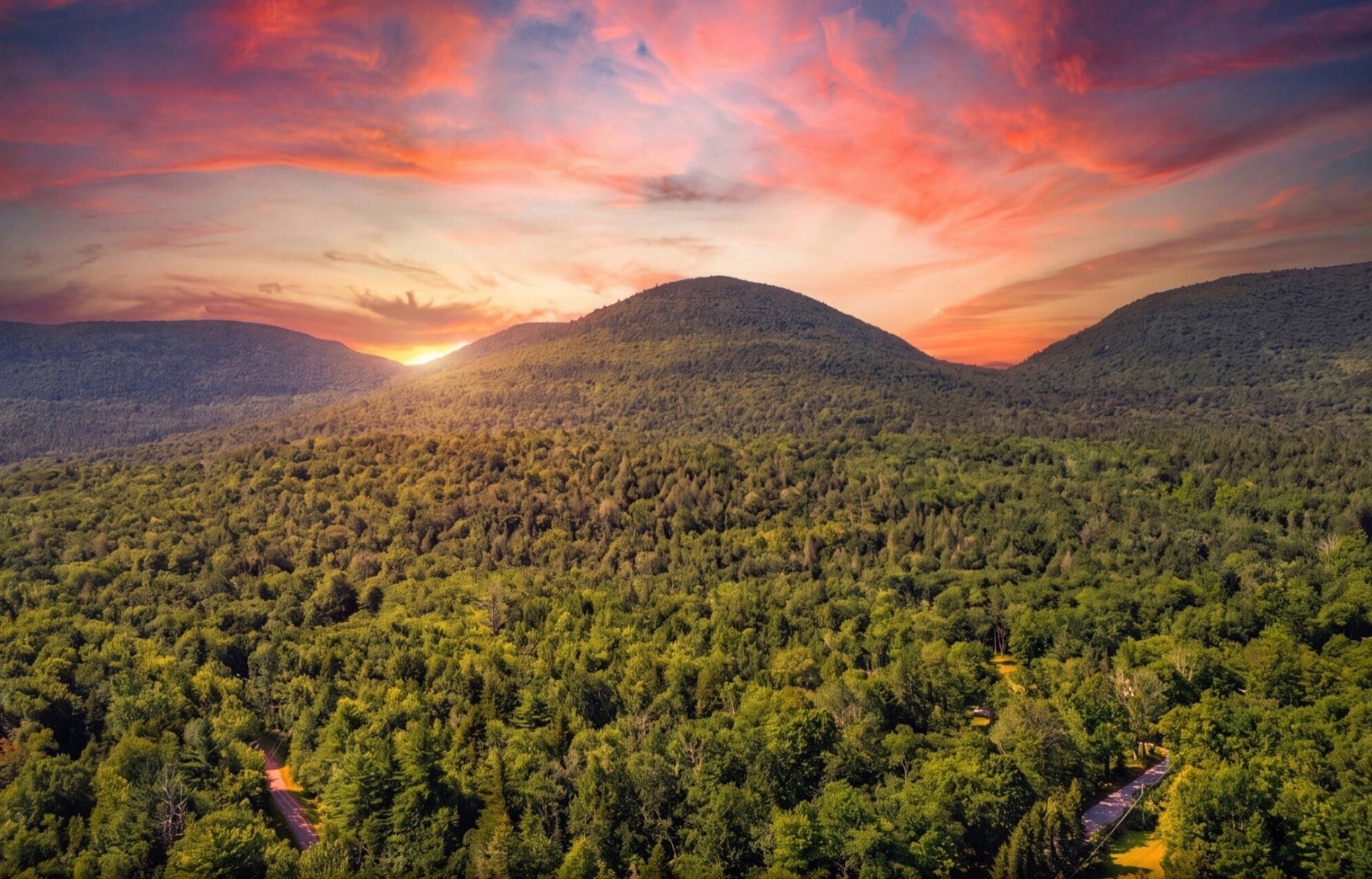 Sunset over forested Hudson Valley mountains